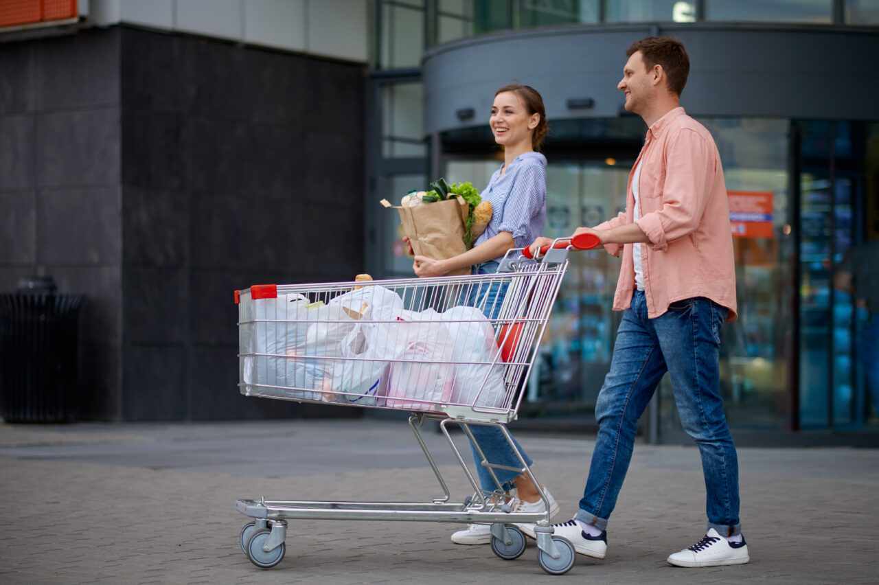 family-couple-with-cart-on-market-car-parking-2021-09-04-04-07-49-utc-1280x852.jpg