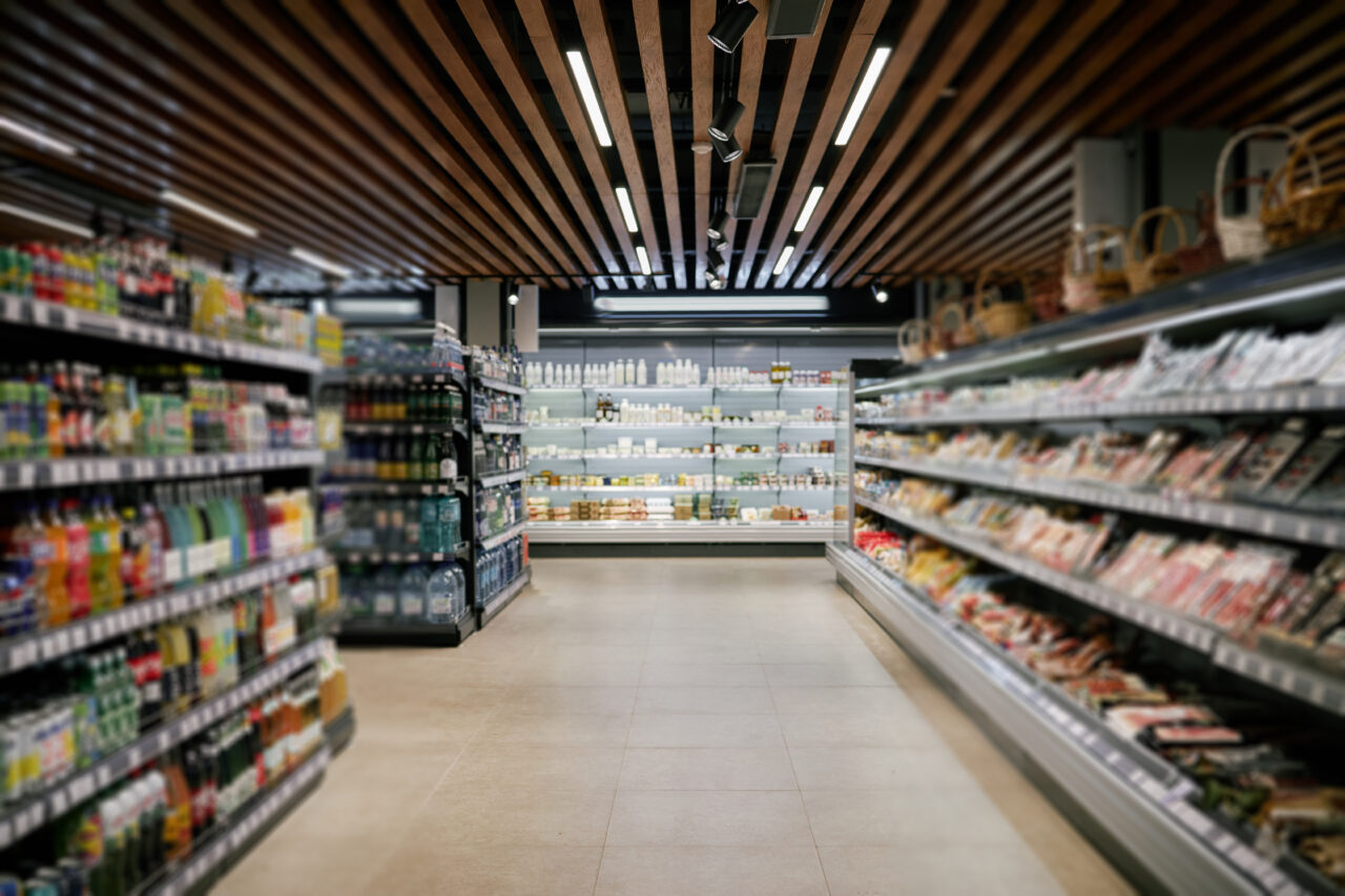 shopping-along-shelves-in-modern-supermarket-aisle-2026-03-25-07-46-34-utc-1280x853.jpg